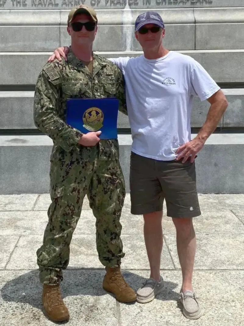 John Davenport in Navy uniform at a graduation ceremony