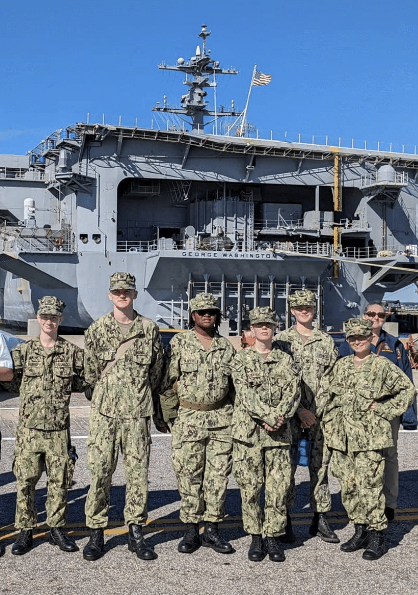 AMERICA Division recruits on the deck of a Navy destroyer during a ship visit