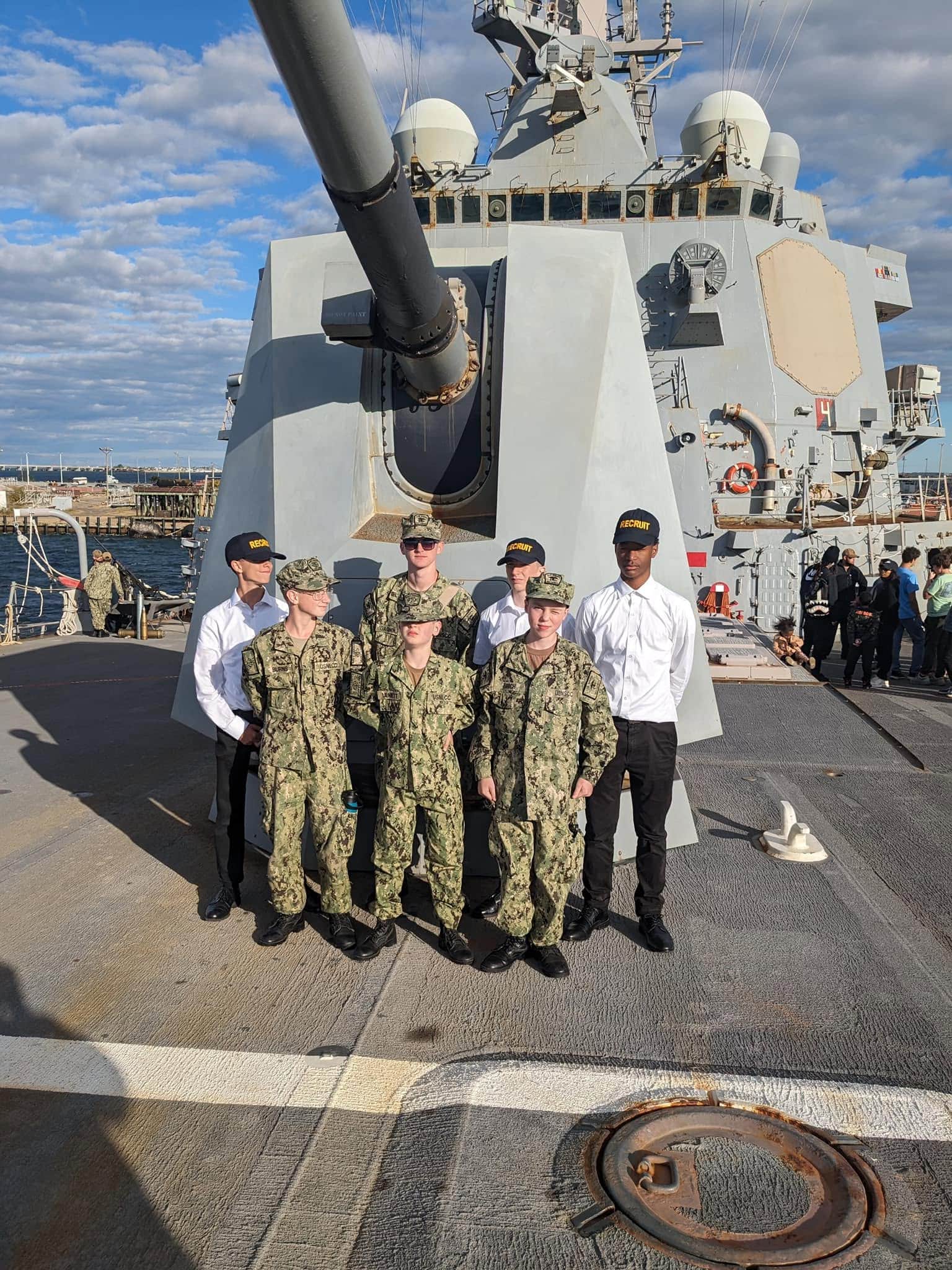 AMERICA Division cadets standing in front of the USS George Washington aircraft carrier