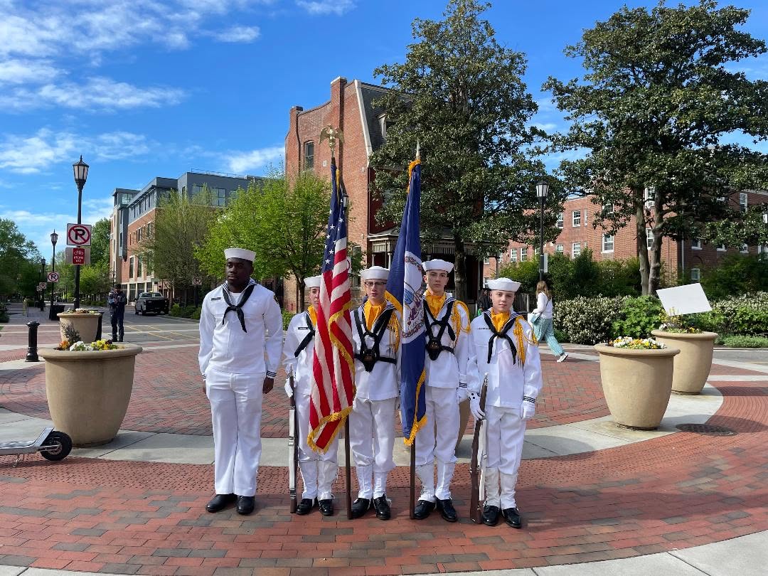 America Division color guard in white dress uniforms with American and Virginia flags