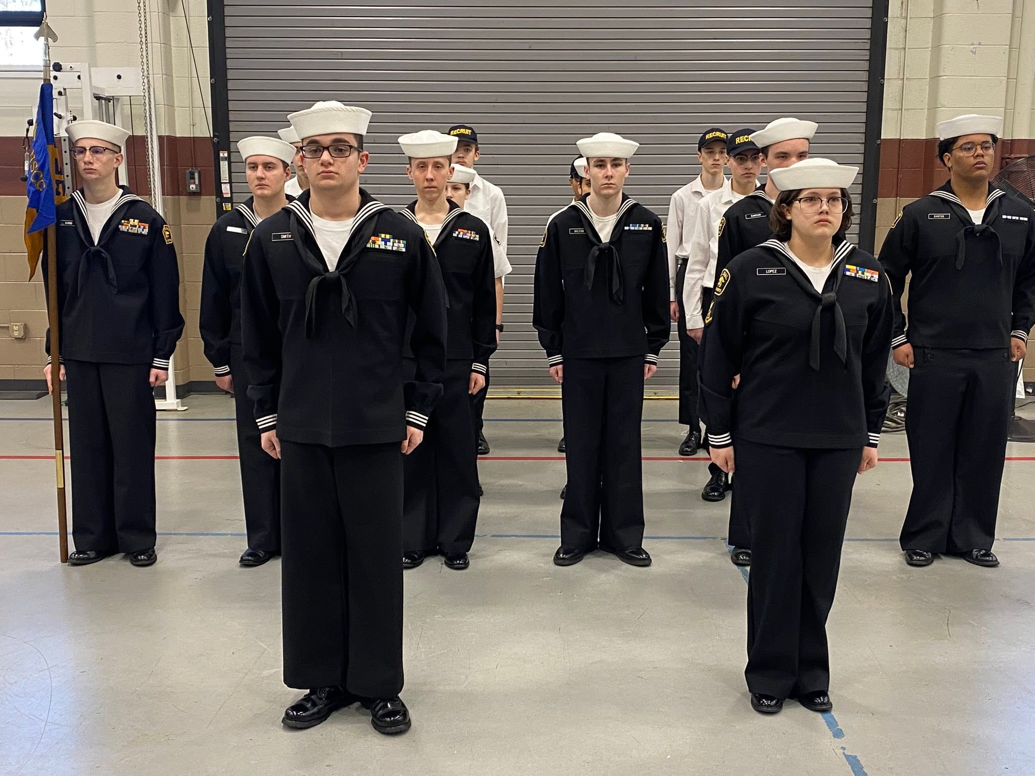 Close formation of cadets in dress blues with medals visible